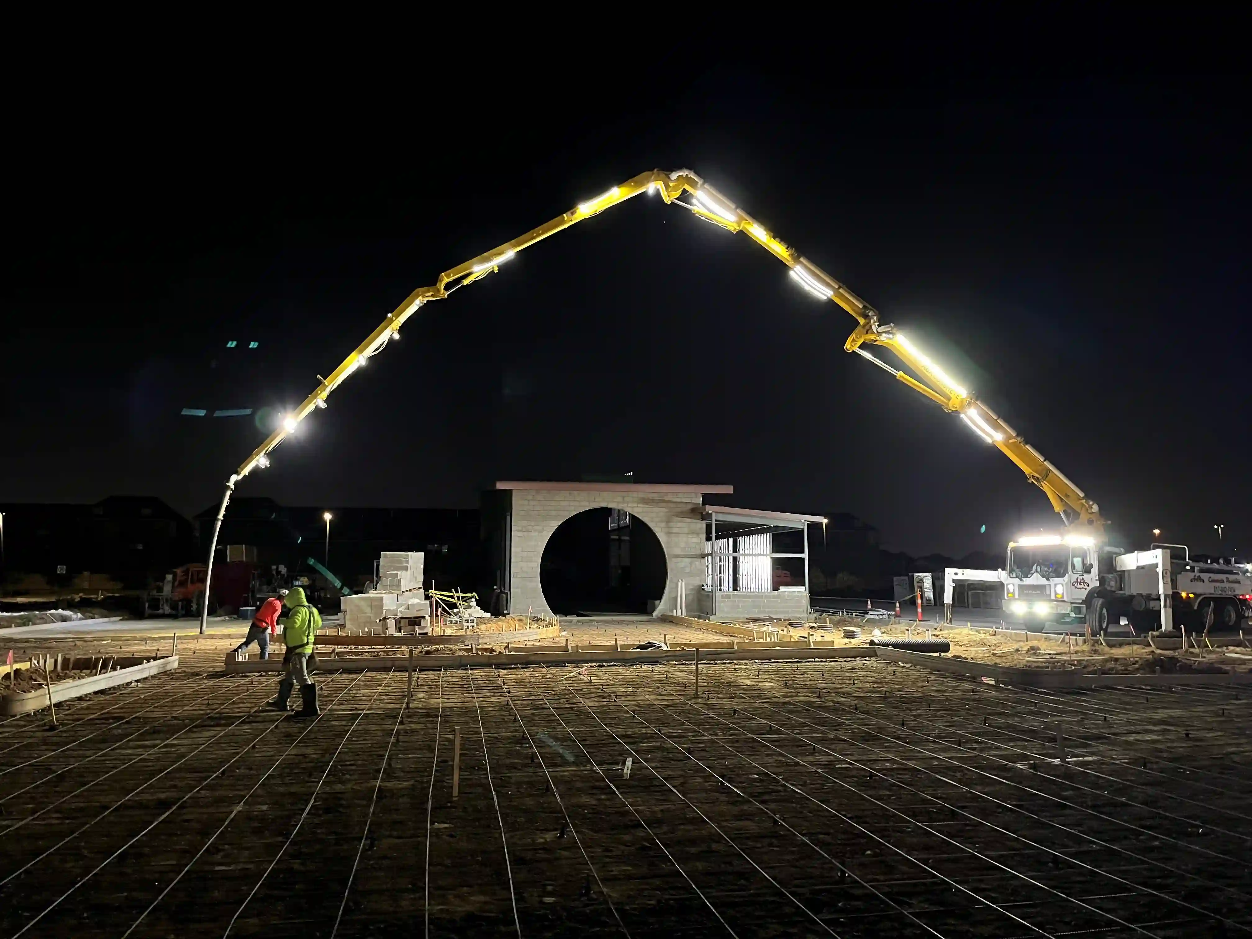Nighttime commercial concrete pump pour — ground-up construction in Fort Worth, Texas by 1836 Commercial